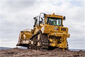 Pottstown Division: A Caterpillar D8T rips material.