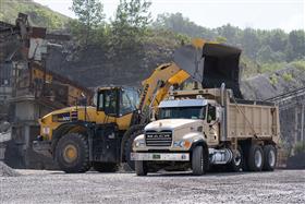 Naceville Quarry: A Komatsu WA-500 loads a dump truck with aggregate.